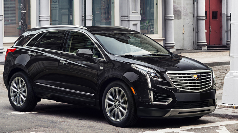 Passenger side view of a used black 2019 Cadillac XT5